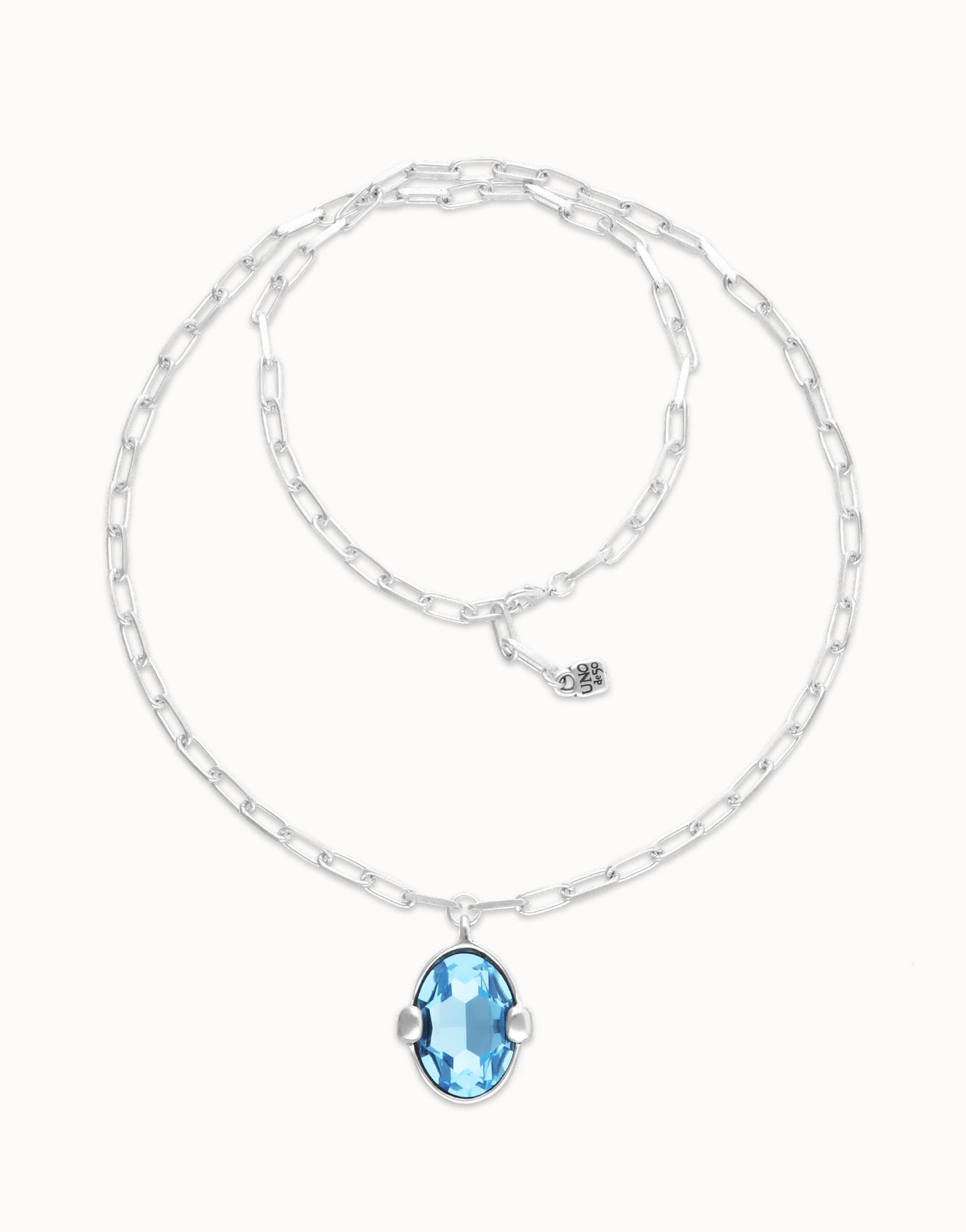 Long necklace with large blue oval faceted crystal