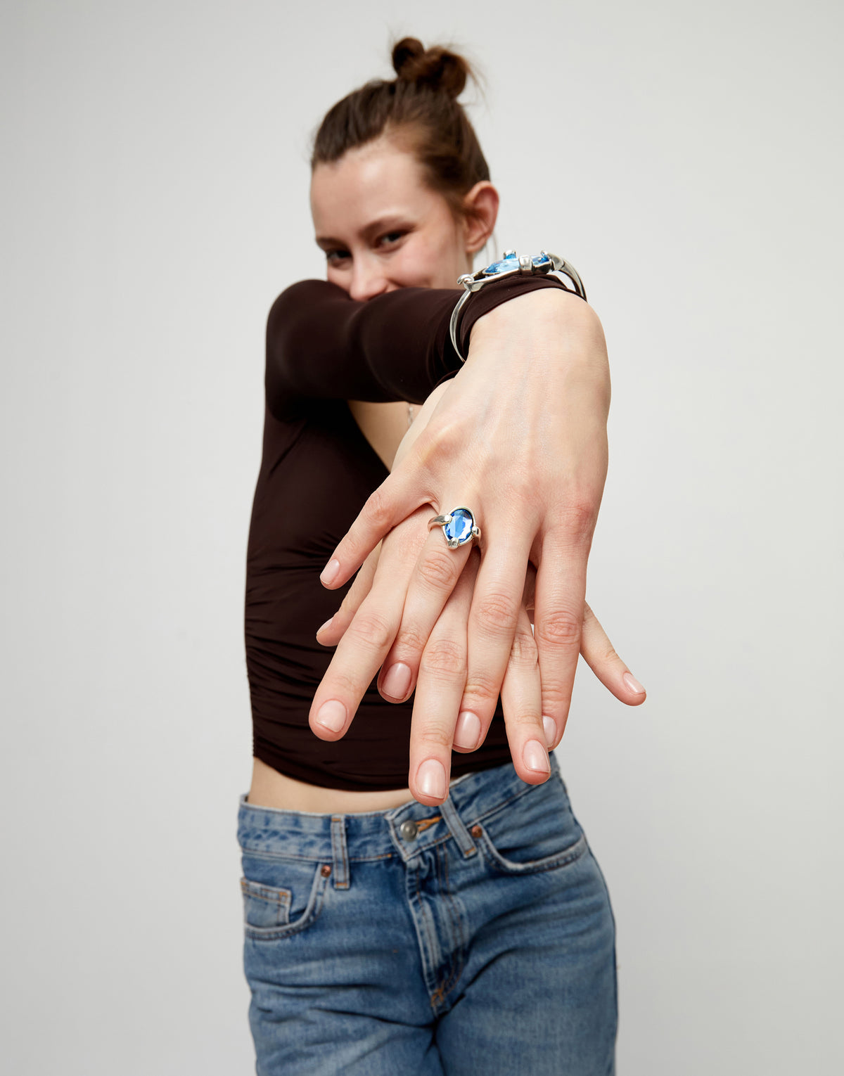 Ring with blue oval faceted crystal