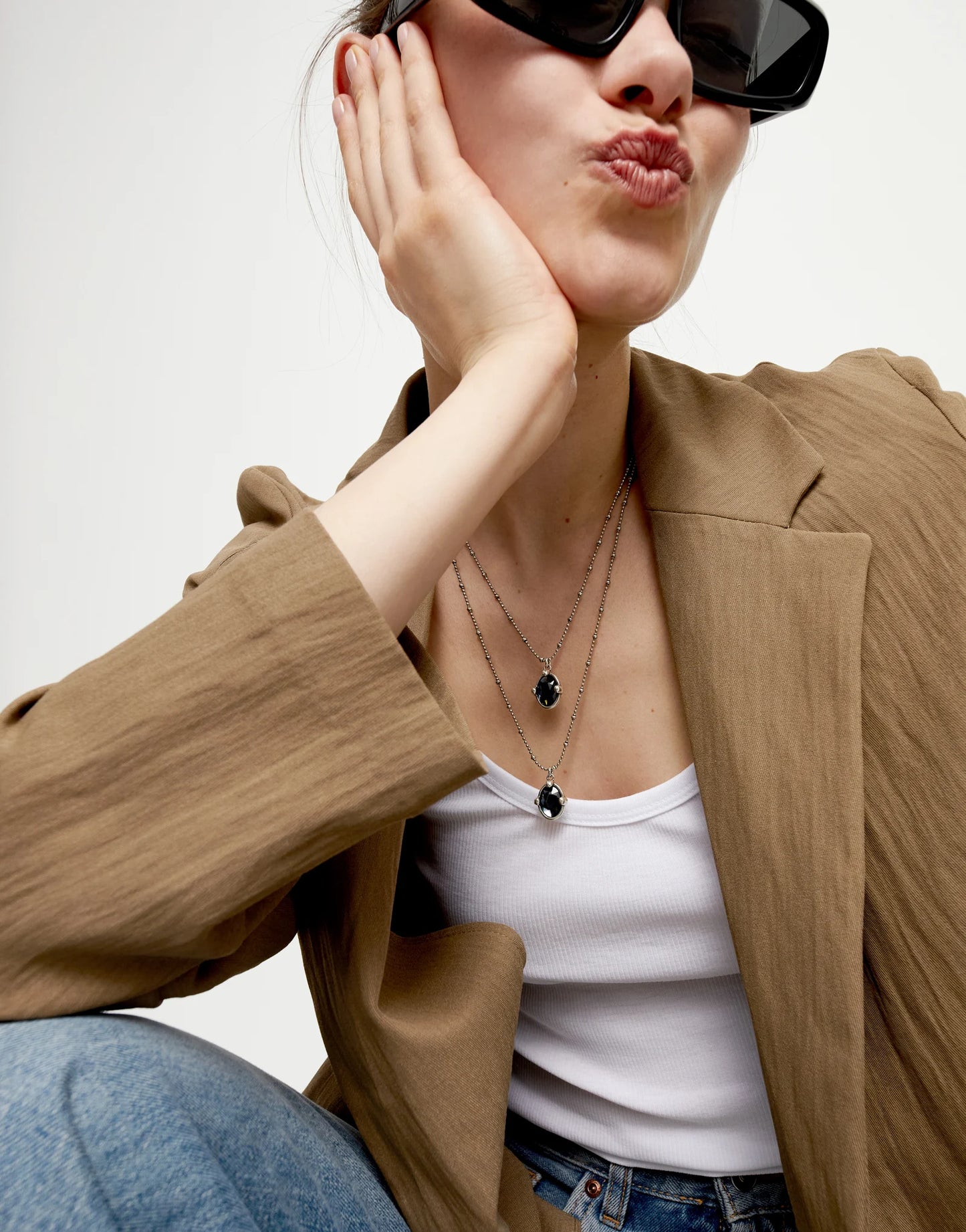 Multi strand necklace with two black oval faceted crystals null