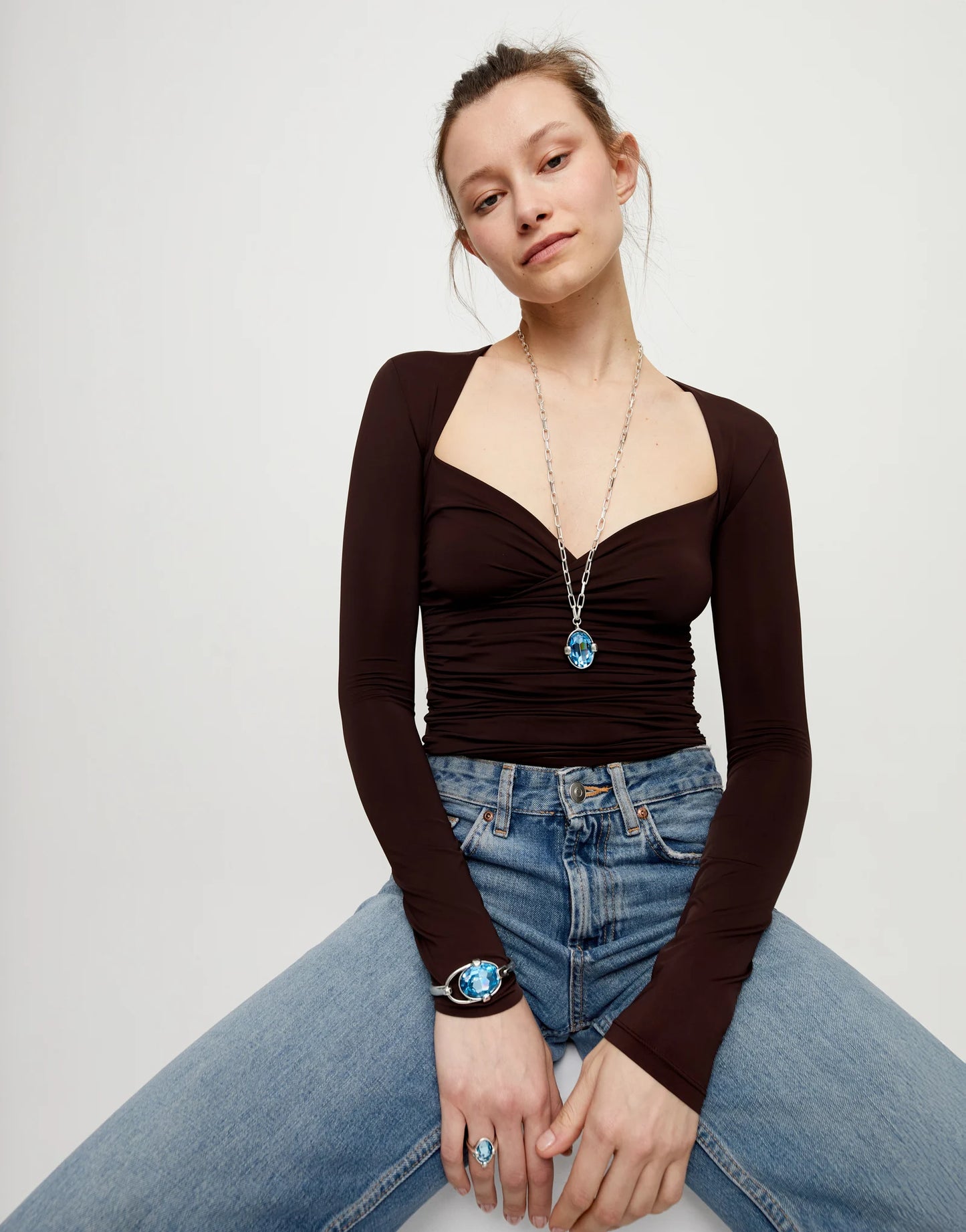 Long necklace with large blue oval faceted crystal