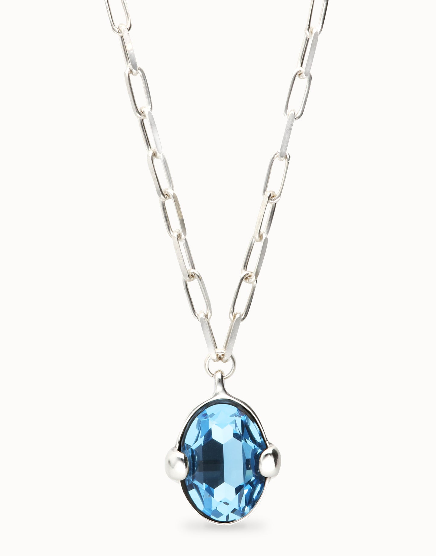 Long necklace with large blue oval faceted crystal