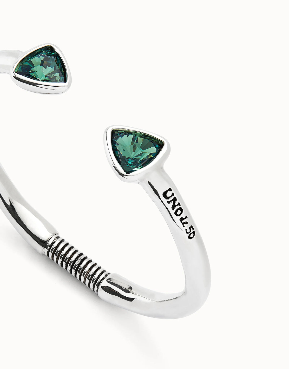 Cuff bracelet with two green crystals