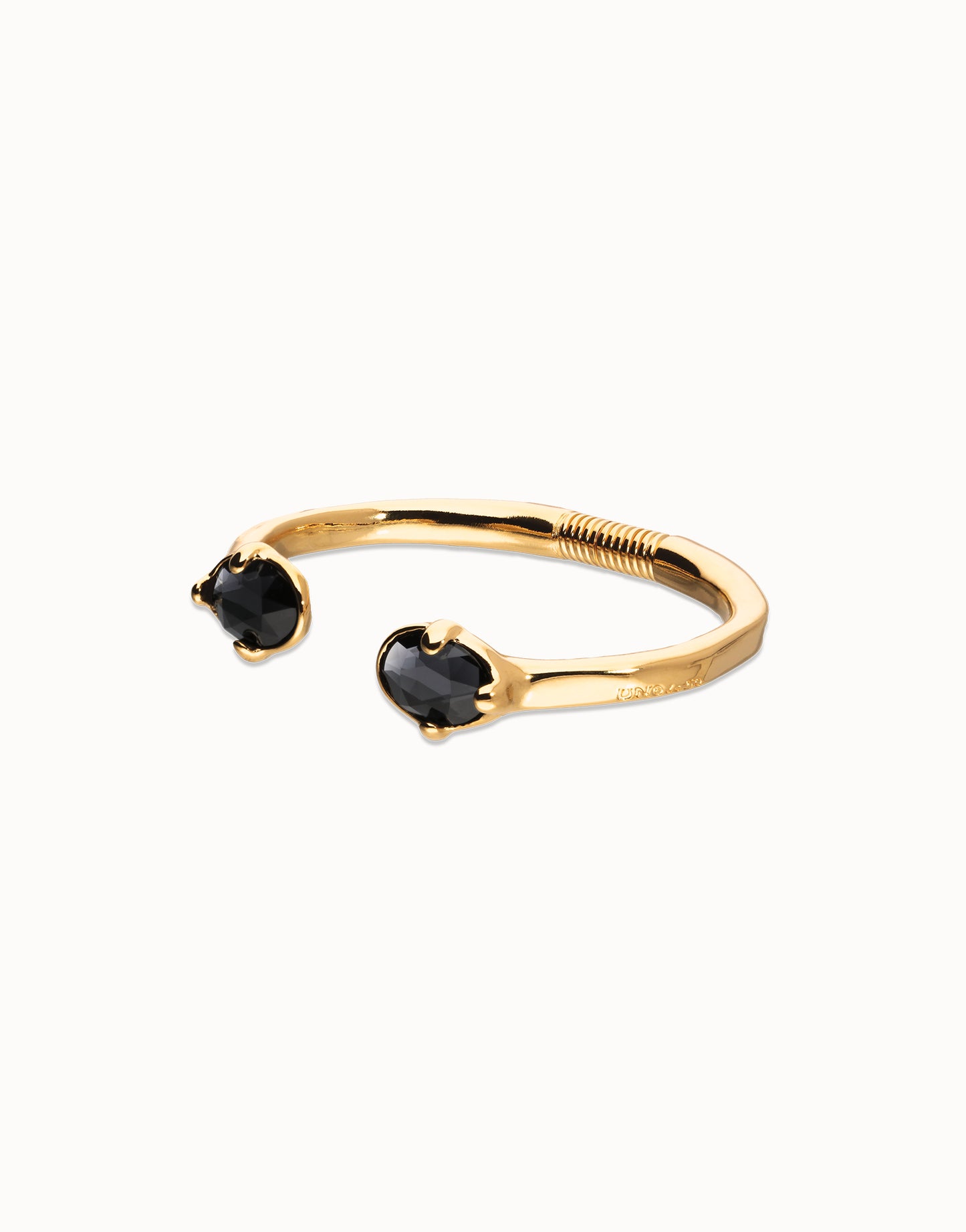 Bangle bracelet with two faceted black oval crystals